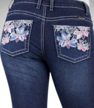 Blue jeans with floral embroidery on the pockets against a gray background